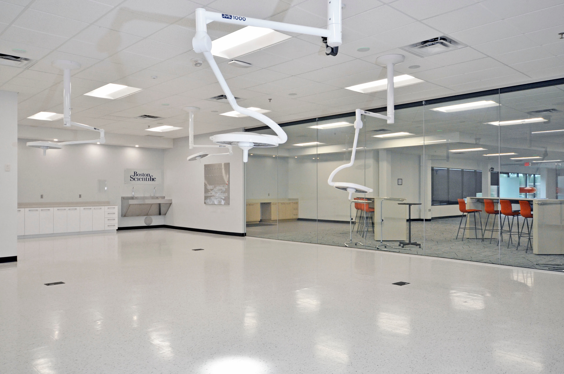 FDA-qualified cleanroom with surgical booms and glass conference wall